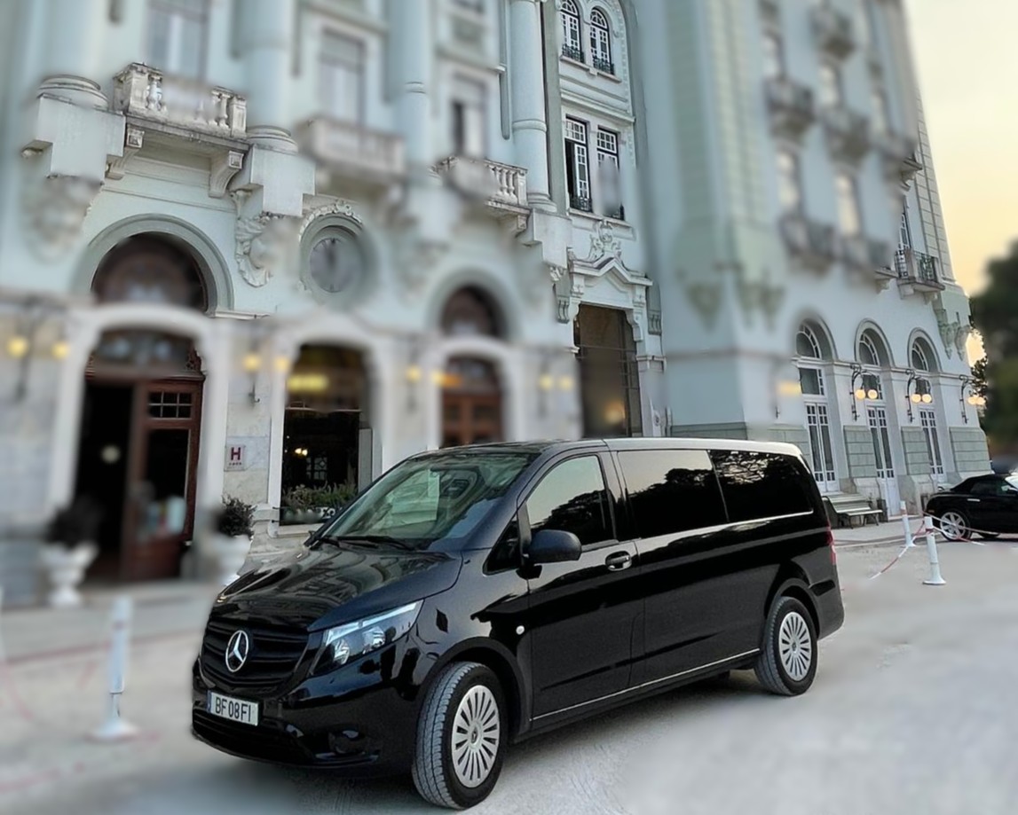 Selective Travel Mercedes van parked in front of a historic building